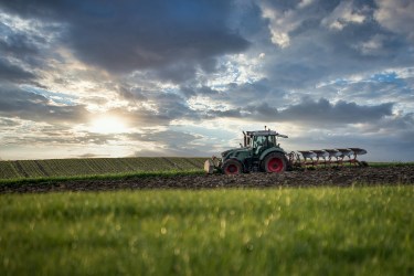 Tractor ploughing in an agricultural field