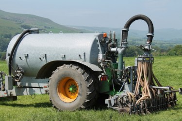 Slurry tanker in a field in summer